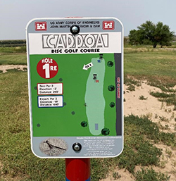 One of the tee signs in the Caddoa Disc Golf course.